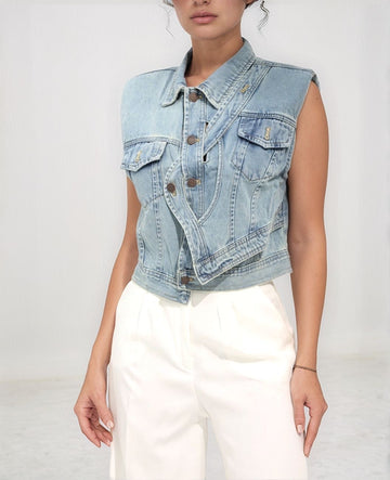 Backcountry Denim Vest – front view of light‑blue denim vest with bronze buttons and raw armholes