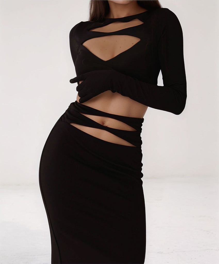 Front view of Chic Temptress black cut-out gown with long sleeves and sculpted bodycon fit