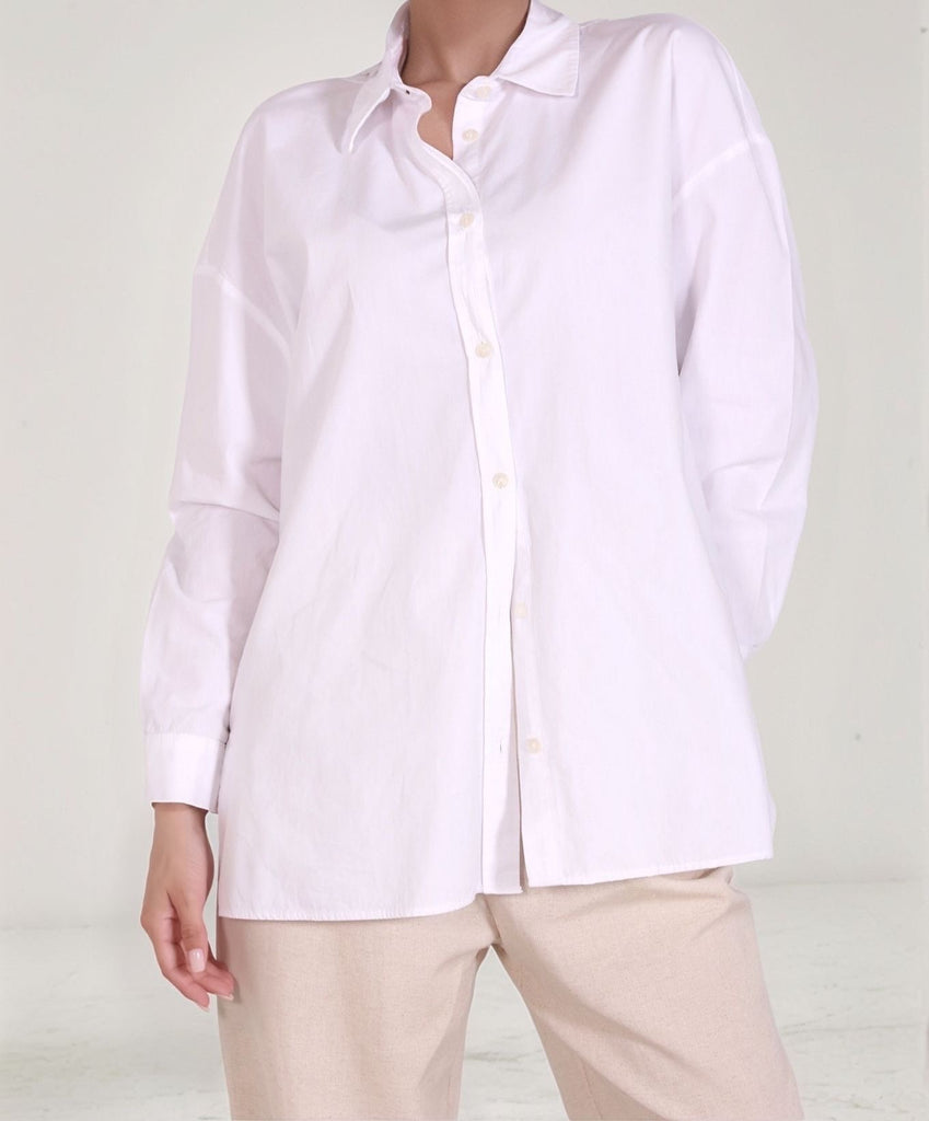 Classic White Shirt – side view showing loose oversized cut and smooth white cotton texture