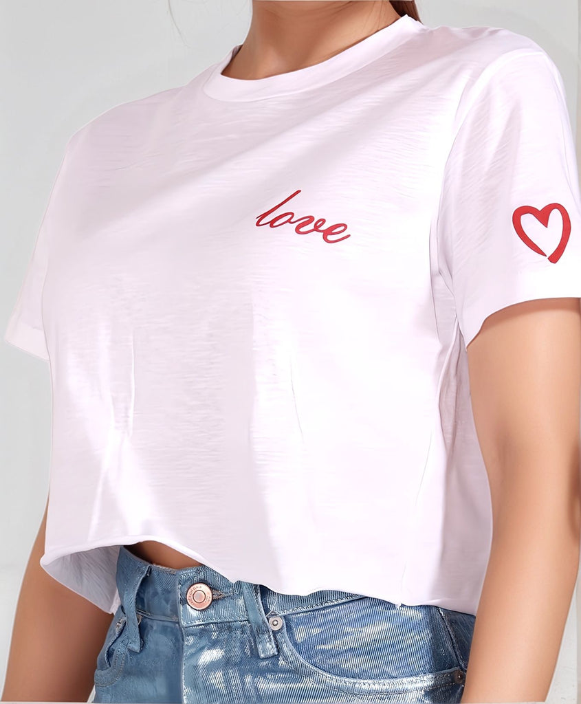 Love T‑shirt – close-up of raw-edge hem and lightweight white cotton texture, paired with Metallic Denim