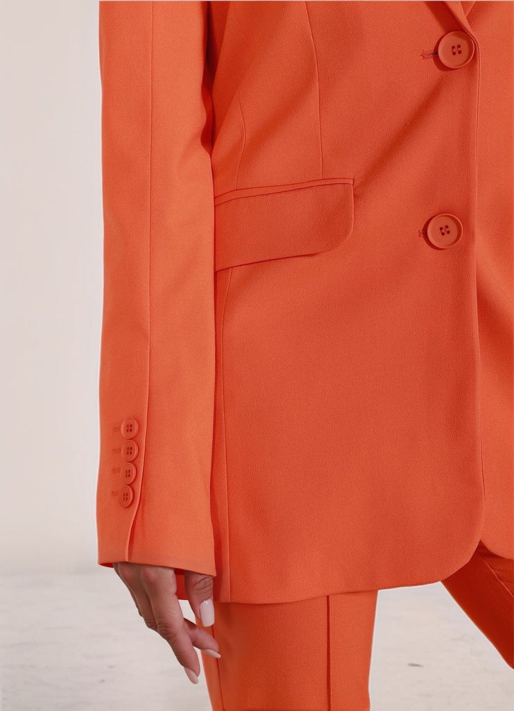 Orange Tailored Set – close-up detail of orange blazer fabric and buttons