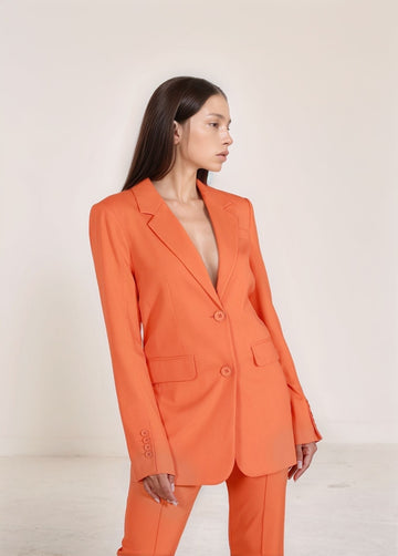 Orange Tailored Set – front view of tailored blazer and pants ensemble