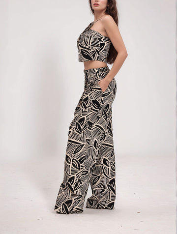 Peerless Printed Set – side view of twist-front crop top and wide-leg pants in black and beige abstract print