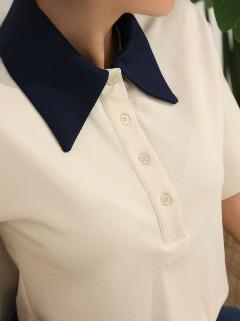 Close-up fabric detail of Polo P showing soft modal-polyester blend in beige