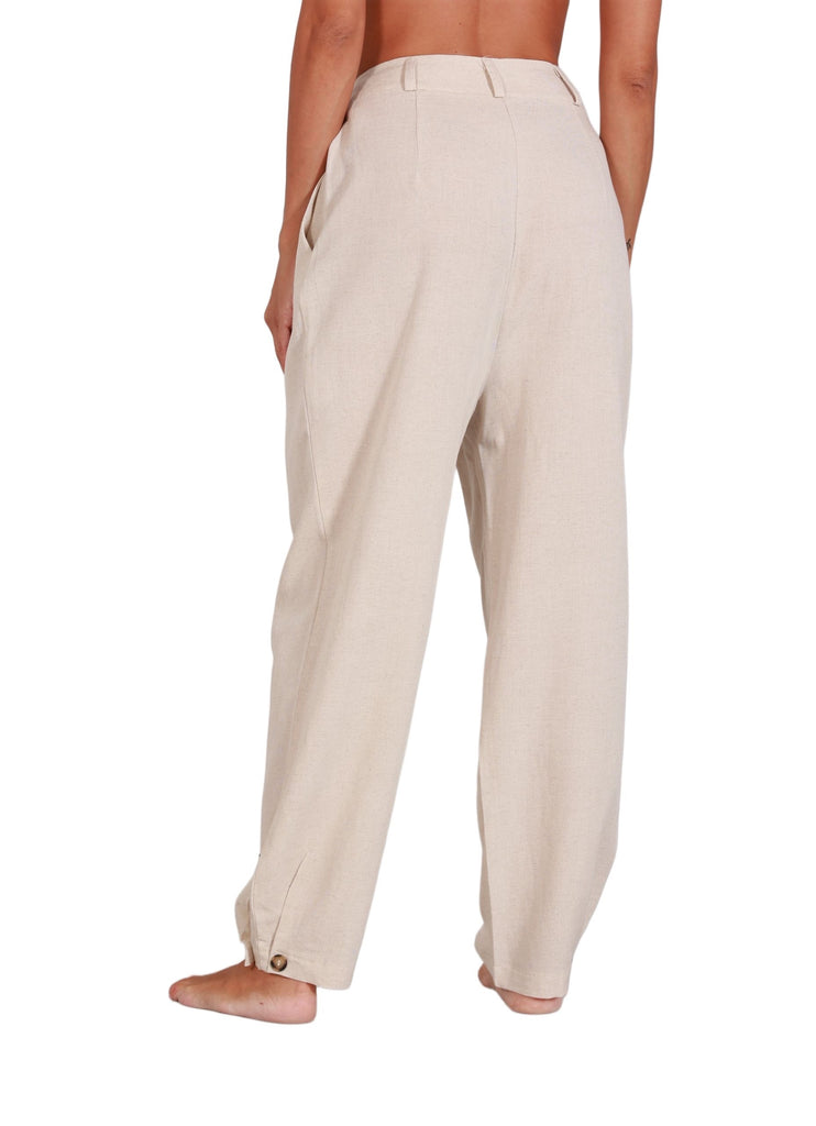 Back view of Sandy Trouser showing flowy silhouette and soft fabric in beige