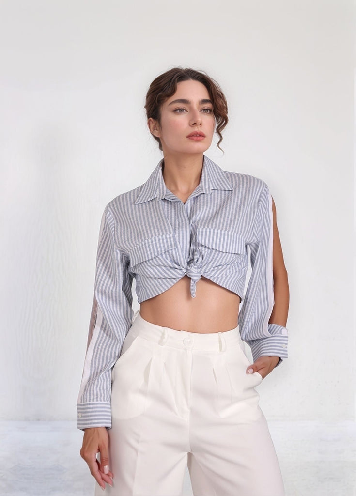 Skyline Shirt – front view of light blue striped cotton‑poly blend shirt with arm cutout and relaxed fit