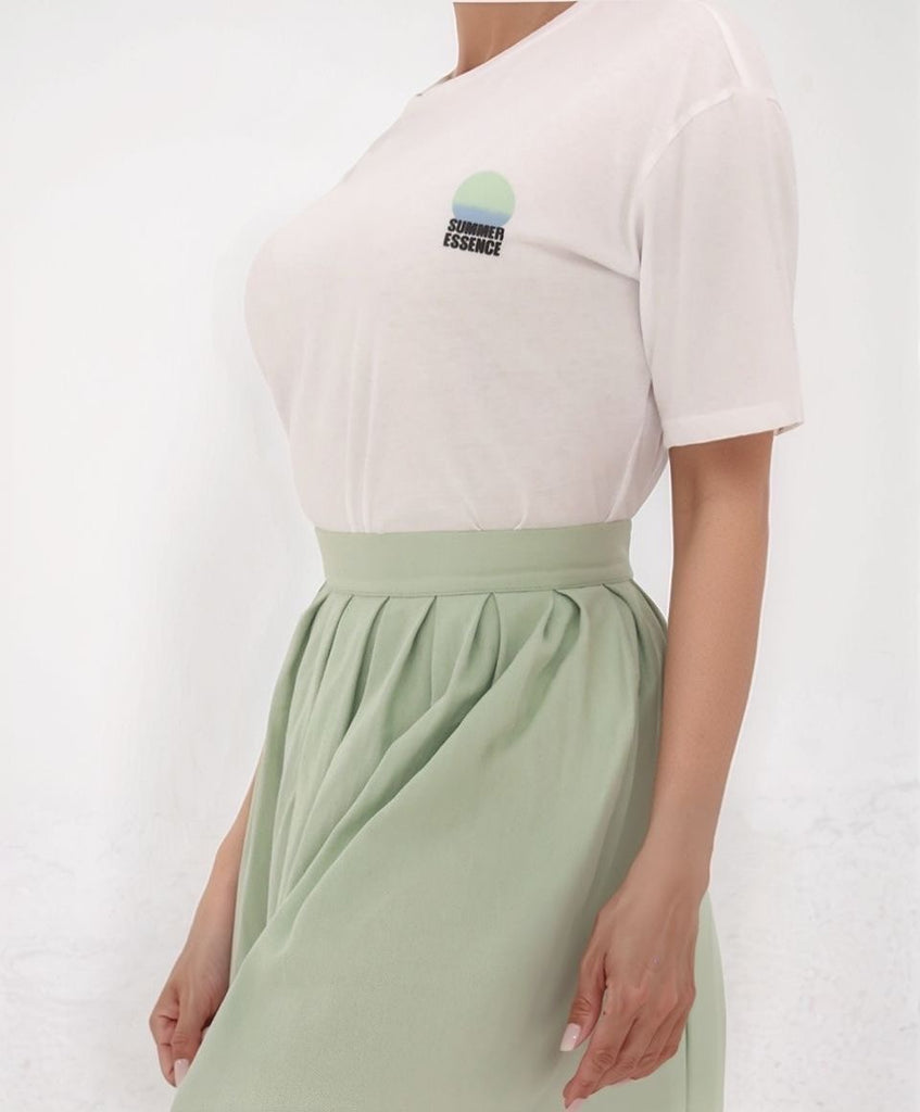 Gamine Summer Essence top – side view of white cotton tee styled with sea foam Muse A Skirt, featuring a soft crew neck and relaxed fit