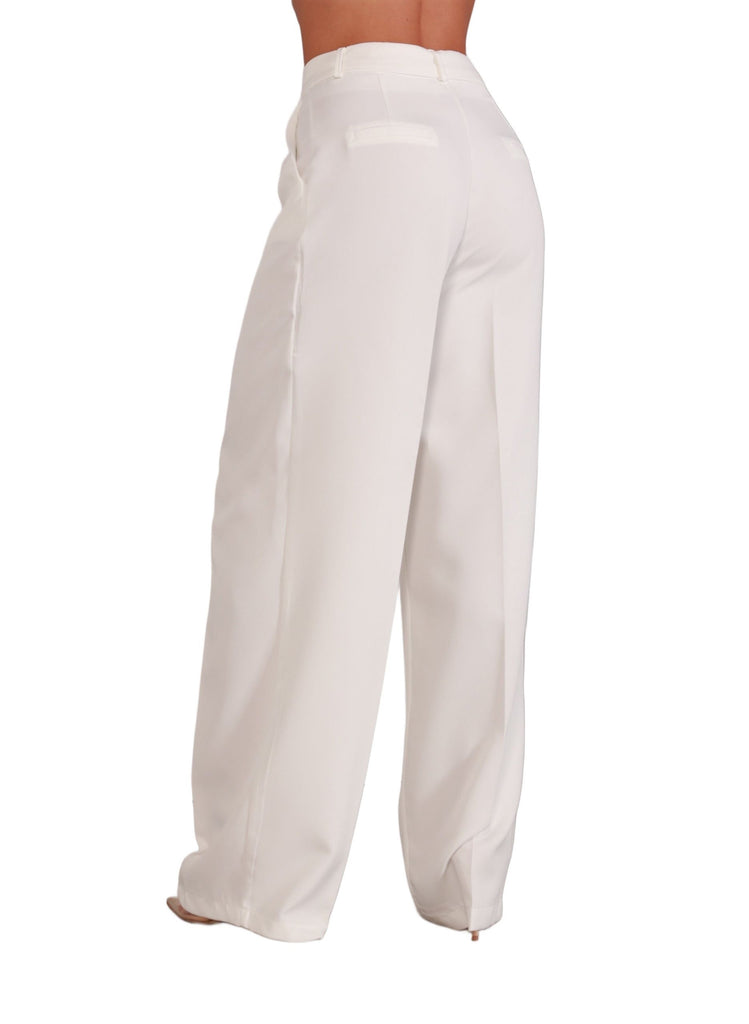 Timeless Classic – back view of white trousers showing straight-leg cut and tailored finish