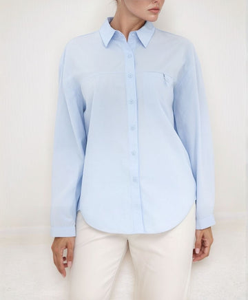 Urban Tranquility Shirt – front view of light‑blue cotton shirt with collar and curved hem